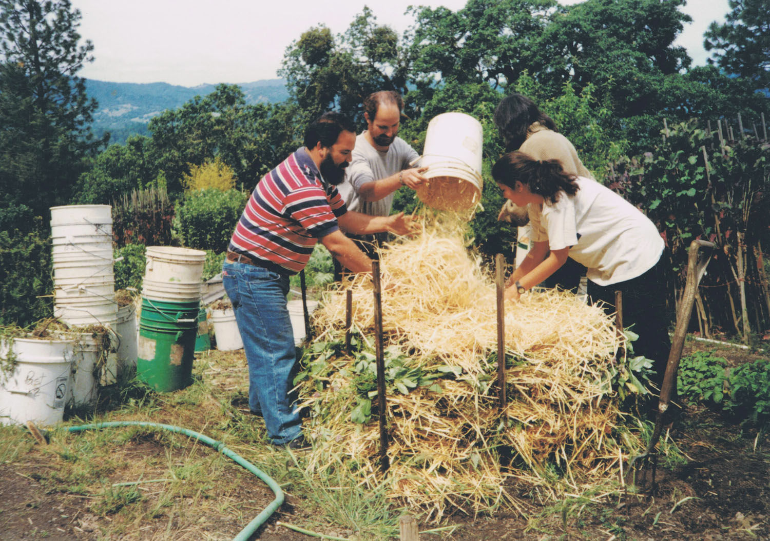 Workshop participants build a GB compost pile in Ecuador